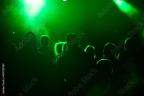crowd at concert and silhouettes in stage lights © Melinda Nagy