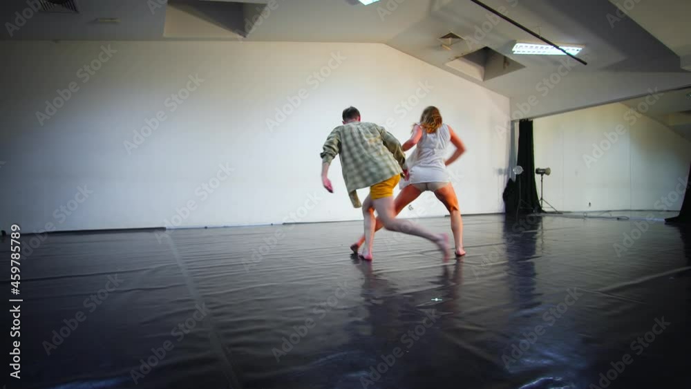 The couple of beautiful teenage practicing modern ballet dance The couple of beautiful teenage practicing modern ballet dance