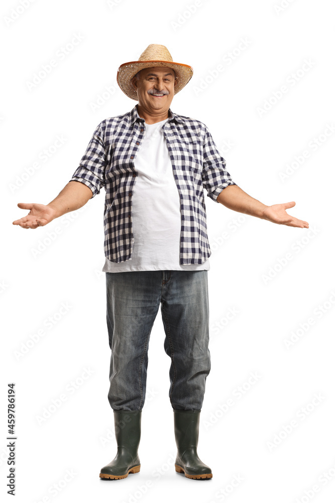 Full length portrait of a smiling mature farmer with a straw hat gesturing with hands Full length portrait of a smiling mature farmer with a straw hat gesturing with hands