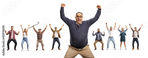 Excited mature man standing in front of people gesturing happiness