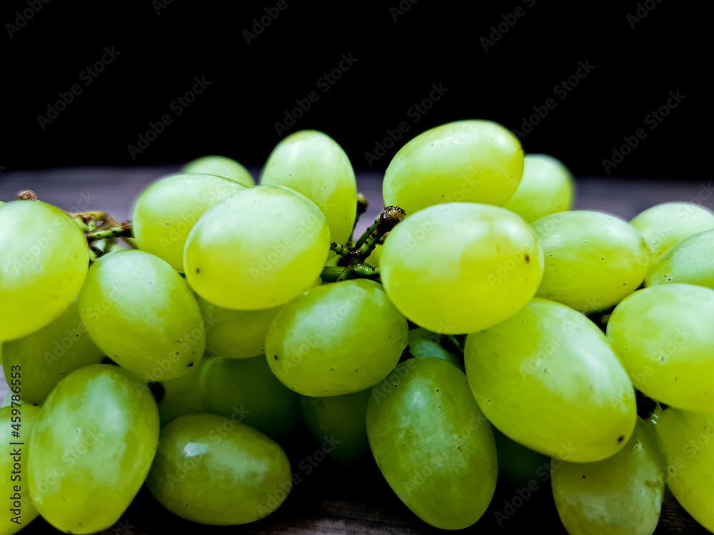 The Natural fresh green grapes close-up. Bunch of grapes. The Natural fresh green grapes close-up. Bunch of grapes.