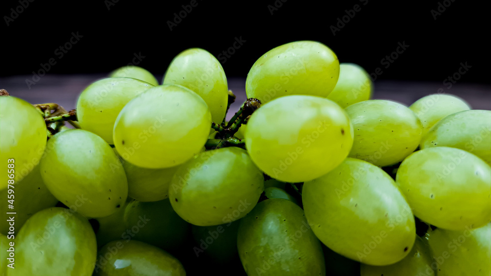 The Natural fresh green grapes close-up. Bunch of grapes. The Natural fresh green grapes close-up. Bunch of grapes.