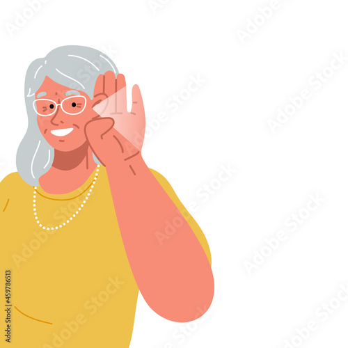The old lady smiles and holds her hand near her ear.The elderly woman listening or hearing intently.