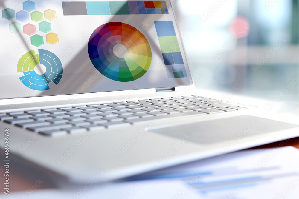 Laptop of web designer with colorful palette Laptop of web designer with colorful palette