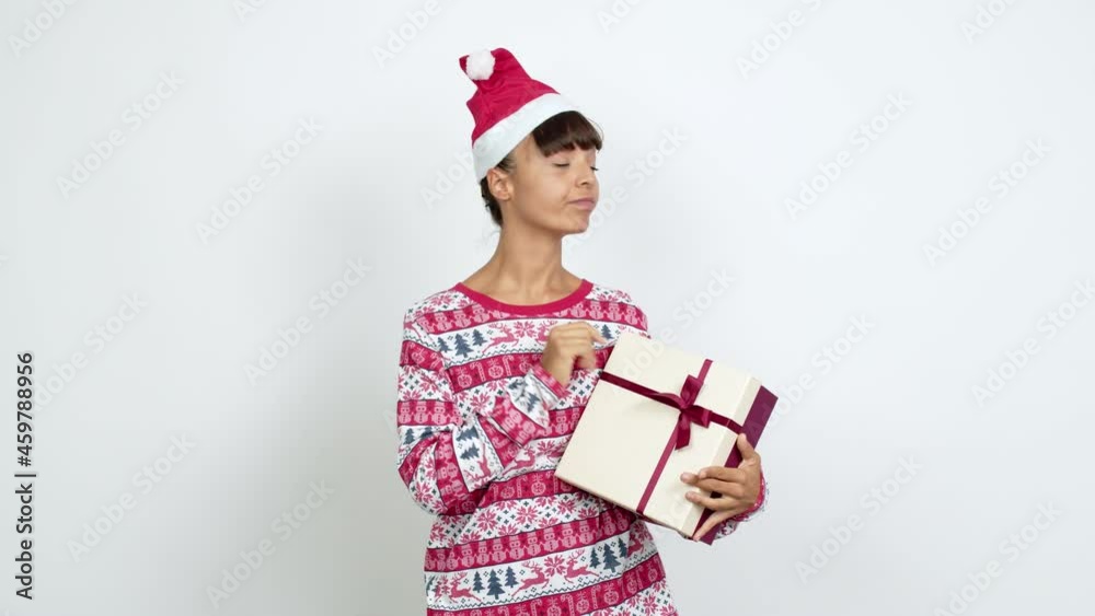 Young woman with christmas hat doing NO gesture over isolated background Young woman with christmas hat doing NO gesture over isolated background