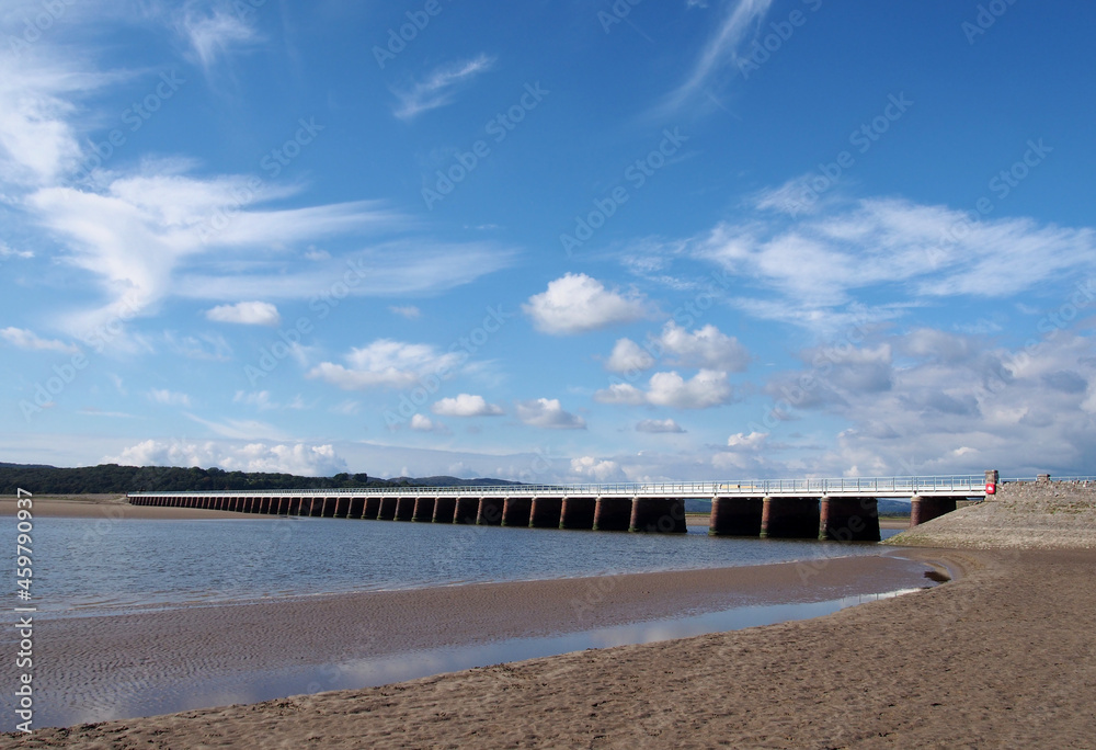 view of the beach at arnside with the leven railway viaduct and river in the south lakes area of cumbria