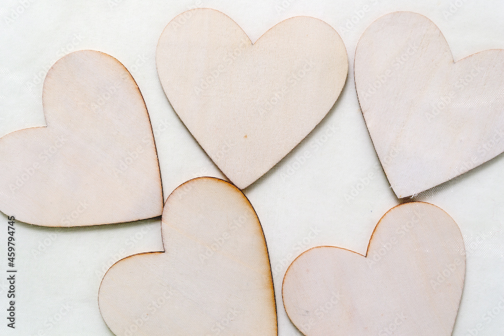 Obraz premium wooden hearts in a green nylon bag