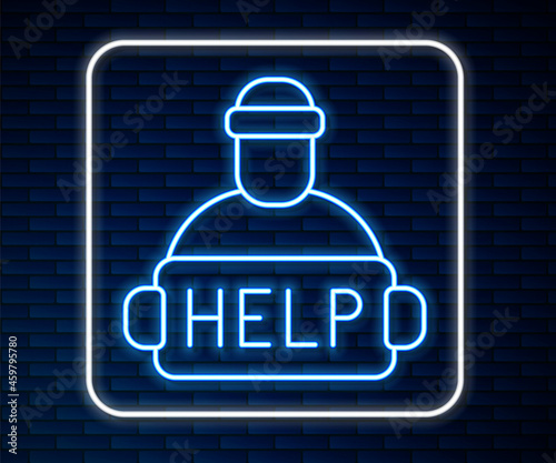 Glowing neon line Man with cardboard on the city street is asking for help icon isolated on brick wall background. Poor homeless beggar. Homelessness problem. Vector