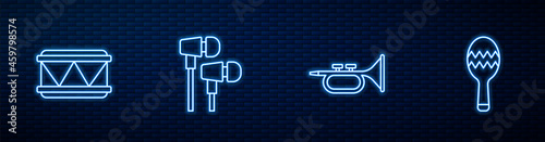 Set line Trumpet, Drum, Air headphones and Maracas. Glowing neon icon on brick wall. Vector
