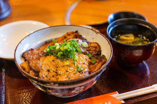 фотографія popular bowl of rice covered with pork served in the restaurant in chichibu in s