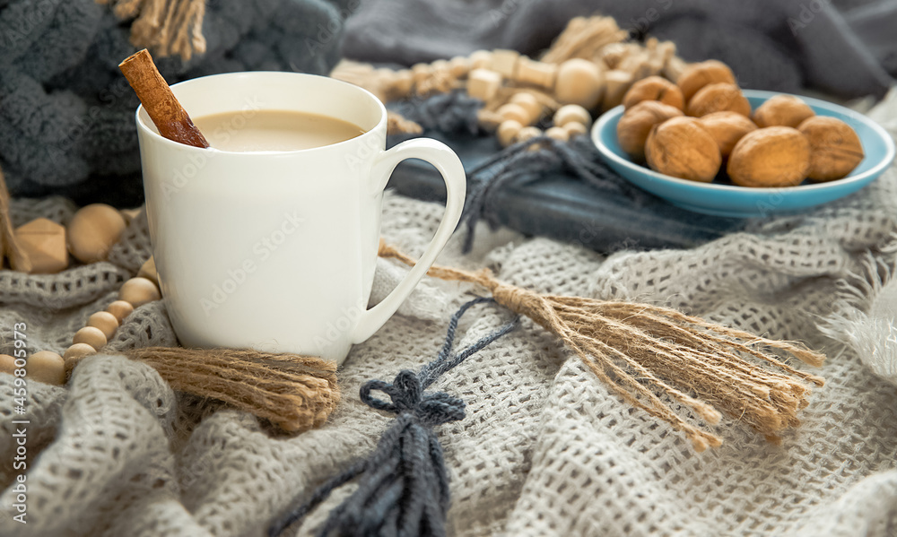 scandinavian style cozy morning with some knitted blankets, cacao mug, gift box, winter and festive mood, cristmas vibe. 
