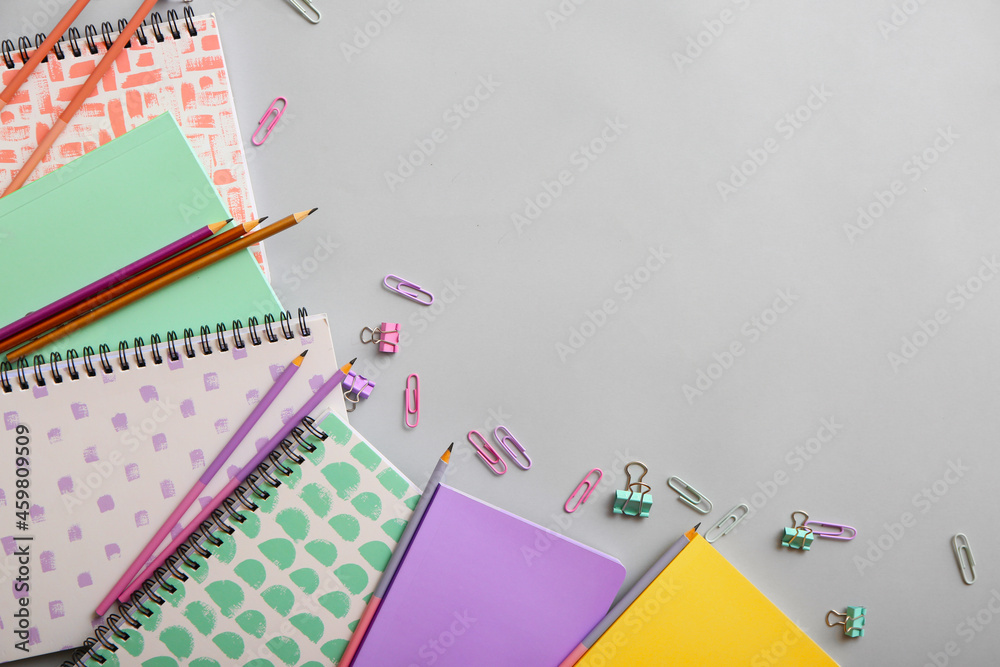 Set of stationery supplies on grey background Set of stationery supplies on grey background