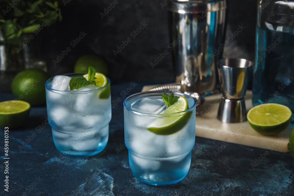 Glasses of cold gin tonic on dark background Glasses of cold gin tonic on dark background