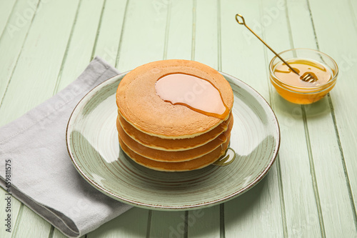Plate of tasty pancakes wit...