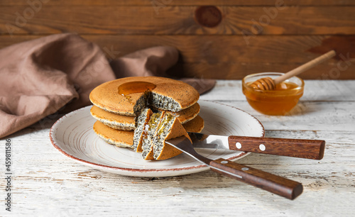 Plate of tasty pancakes wit...