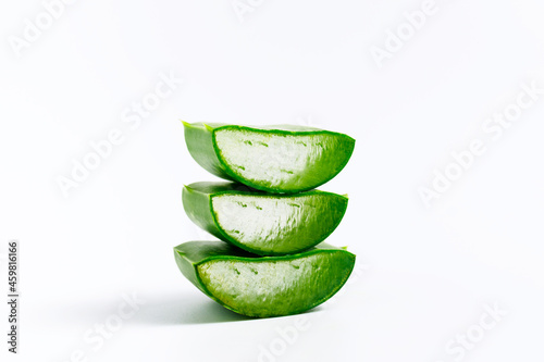 Fresh natural Aloe vera slice on white background. Concept for herbal medicine for skincare and hair care.