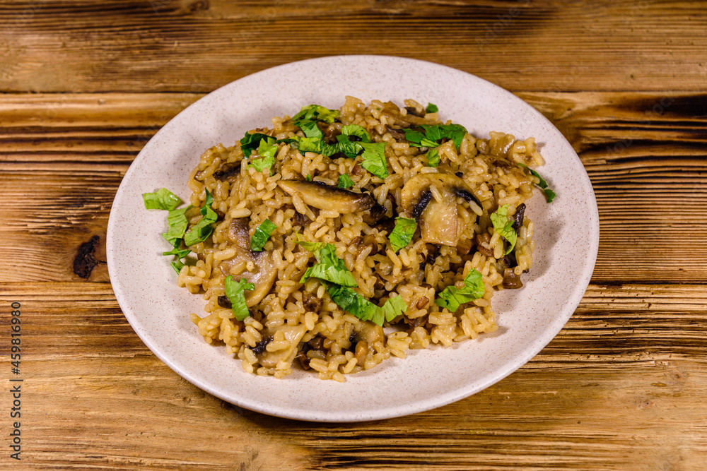 Risotto with mushrooms and paesley in a plate Risotto with mushrooms and paesley in a plate