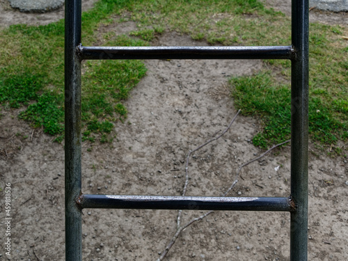 The rungs of a metal ladder