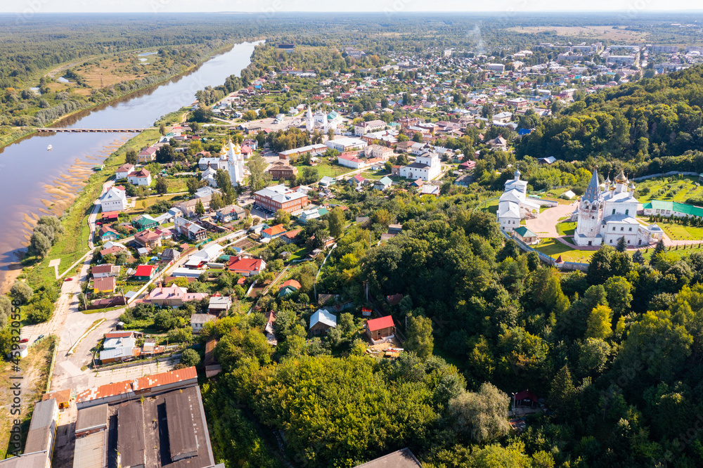 Bird's eye view of Russian town Gorokhovets. Residential buildings and Klyazma River visible form above.