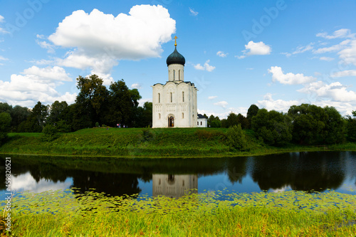 External view of Church of Intercession of Holy Virgin on Nerl River in summertime. © JackF