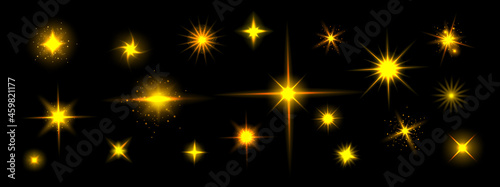 Golden star shine effects, flash lights with sparkles and glow rays isolated on black background. Vector realistic set of bright yellow glare, gold flare with shiny beams