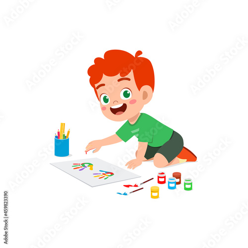 cute little boy using paint to hand for art © Colorfuel Studio