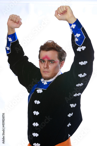 Chinese traditional warrior male costume at studio over grey background. Handsome man wearing national costume in Beijing, China