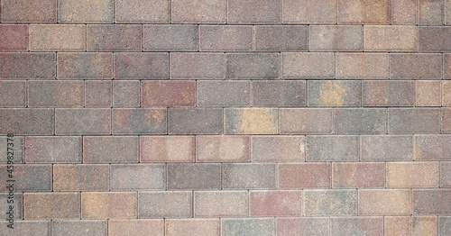 Stone beige paving stones of rectangular shape. Stone brick background. Top view