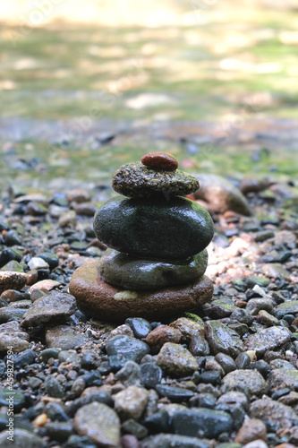 Pyramid of stones in the Japanese style on the river bank. Meditation. Relax.  (ID: 459827594)