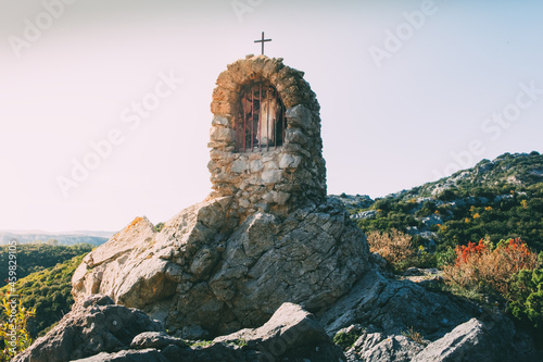Slika na platnu A small statue of the Virgin Mary sheltered in a stone alcove in Corbieres mount