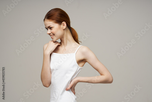 Joyful Woman in White T-shirt Joints Warm Up