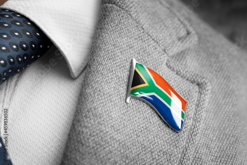 Metal badge with the flag of South Africa on a suit lapel