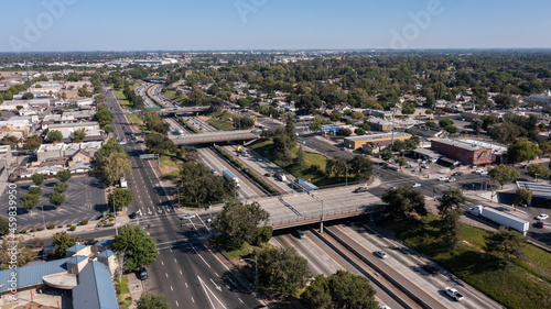 Afternoon aerial view of the 99 Freeway and urban downtown core of Modesto, California, USA.