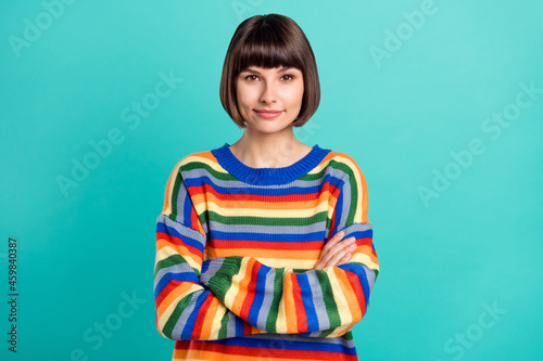 Photo portrait smiling girl smiling stylish clothes folded hands isolated vivid teal color background