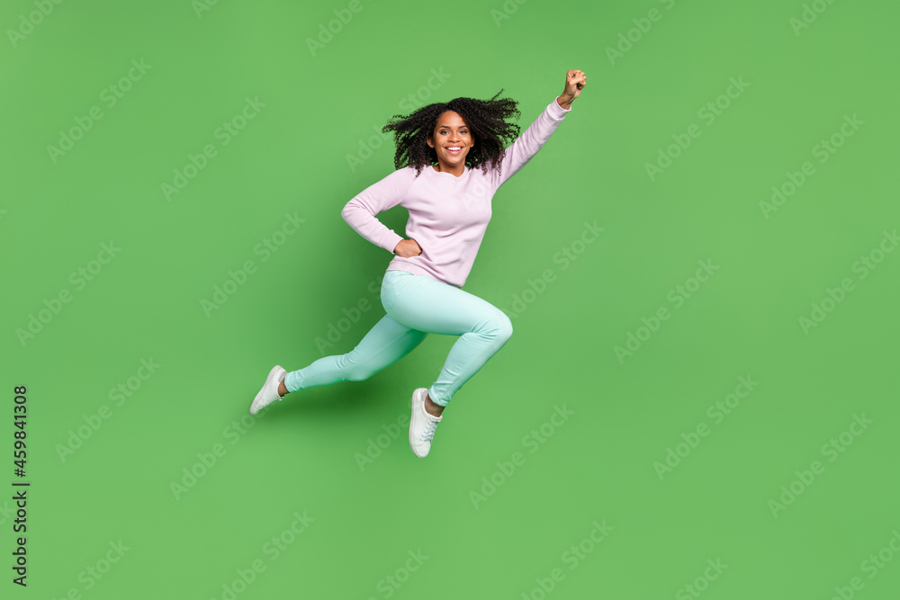 Full length photo of lovely young brunette lady run wear pullover pants shoes isolated on blue background