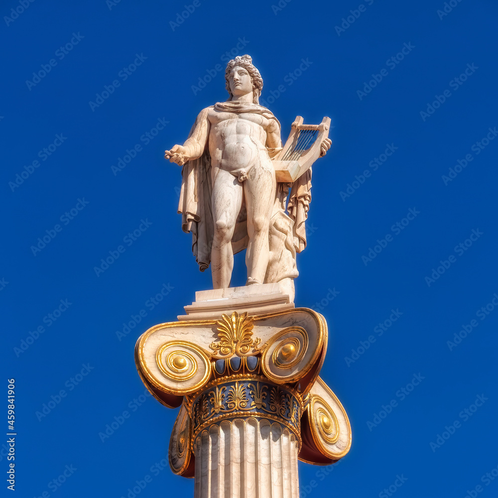 Apollo the ancient Greek god of poetry and music under blue sky with space for your text, Athens Greece Apollo the ancient Greek god of poetry and music under blue sky with space for your text, Athens Greece