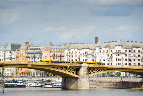 Margaret bridge in Budapest against old tenement houses