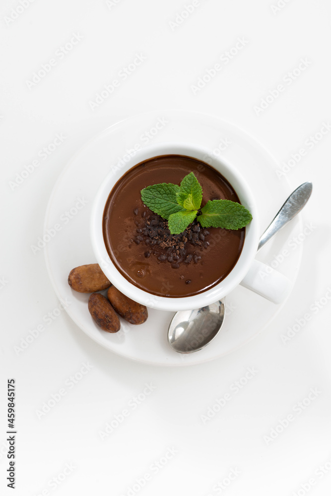 cup with hot mint chocolate on white table, top view vertical cup with hot mint chocolate on white table, top view vertical