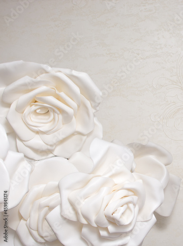 Beautiful background of the bulk of artificial paper roses.Copy space for text