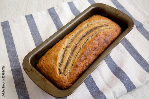 Homemade Banana Bread on a white wooden background, side view. photo