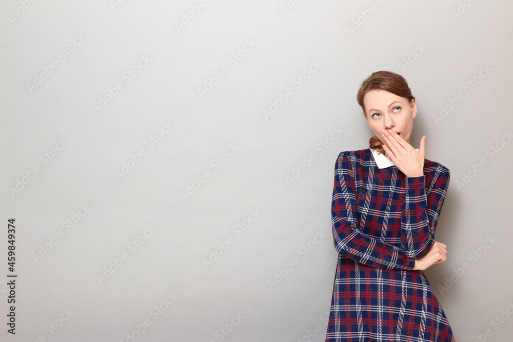Portrait of girl yawning, covering mouth with hand and looking sleepy Portrait of girl yawning, covering mouth with hand and looking sleepy