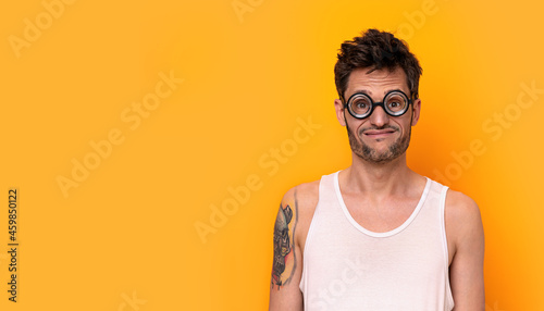 Funny myopic man wearing thick glasses