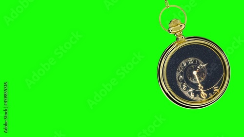 Pendulum of pocket watch on a green background. Looping.