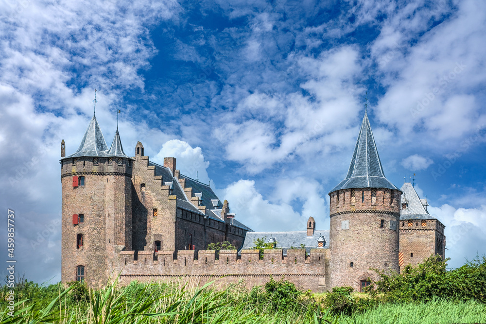 The towers and walls of the Muiderslot protrude high above the surroundings