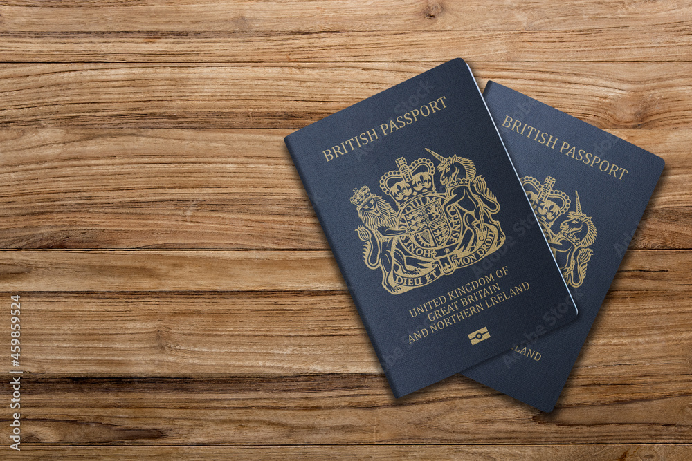 United Kingdom passport on wooden background .A British passport is a travel document issued by the United Kingdom or other British dependencies and territories to individuals United Kingdom passport on wooden background .A British passport is a travel document issued by the United Kingdom or other British dependencies and territories to individuals