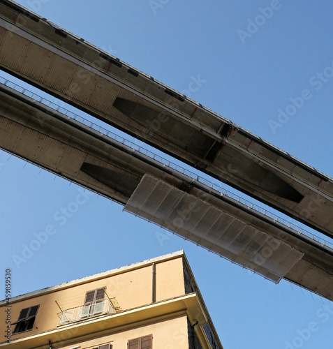 Highway viaduct with scaffolding above the house © Riccardo Arata