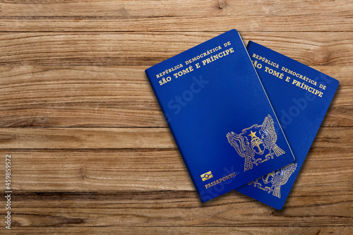 Santomean  passport on wooden background  .The Santomean passport is issued to citizens of Santomean  for international travel.