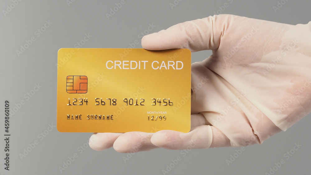 Hand is wear medical glove and holding gold credit card isolated on grey background.