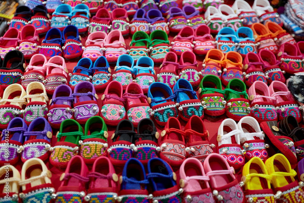 Close-up kid shoes in a night market in Thailand