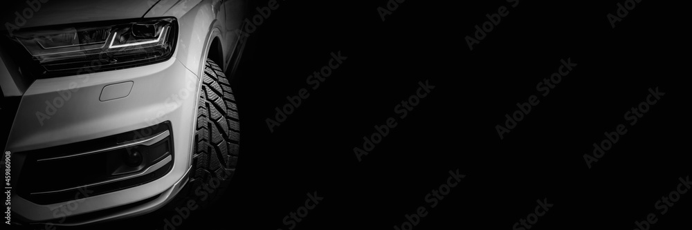 part of the car on a black background, focus on the wheels part of the car on a black background, focus on the wheels